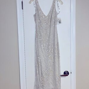 Beautiful T-length beaded Ivory dress. Never worn with tags!! Size 6 (in bridal)